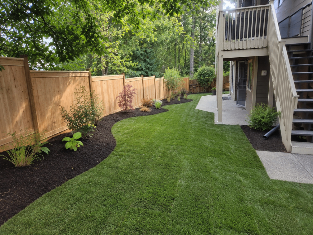 Finished lawn and planting bed installation